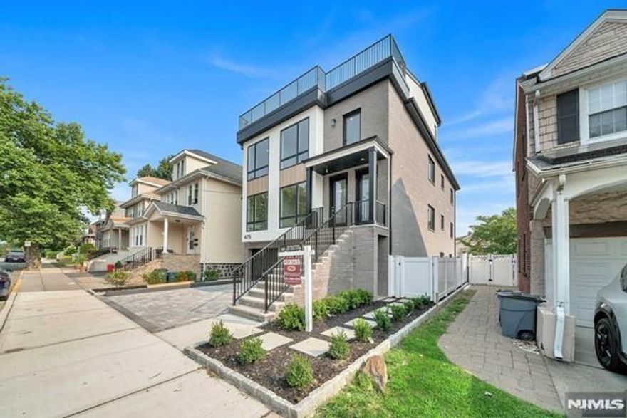 Be the first to live in this brand new apartment conveniently located just a short walk from Bergen Blvd and near parks and Cliffside Park Middle School. The unit features one floor living with 3 bedrooms and 2 bathrooms located on the same floor as the living room, dining room, and kitchen. The primary suite is quietly tucked away in the back of the house and features a bathroom with double vanity and large shower. The living room features an electric fireplace and is open to dining room and a modern kitchen, which includes two toned cabinetry, quartz countertops, undermount lighting, and GE Cafe appliance package with a gas range. The unit comes with a garage on the ground floor and accessible directly within the building, and 1 parking space outside of the garage.