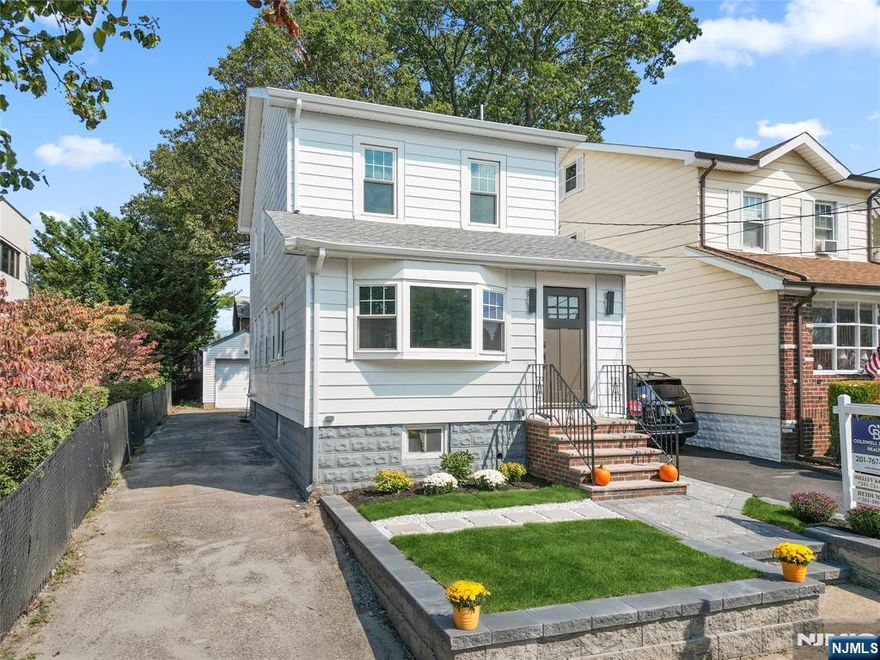 This stunning south facing home is renovated from top to bottom in a prime location, in the heart of Ridgefield situated near major transportation and shopping. The spacious layout features living room, kitchen, dining area and full bath on the first floor. The gourmet kitchen is a chefâ€™s dream, boasting premium stainless-steel appliances, Quartz countertops, and waterfall center island. Hardwood floors throughout. Step right outside the dining room to a private yard with a brand-new paved patio. The second floor has 3 bedrooms, full bath and laundry room. Choose to enter from the side door for privacy and fun in the fully finished basement and full bath. Perfect space for an extended family provides ample room for relaxation and recreation. And an added bonus to this house is a finished attic. Donâ€™t miss this opportunity to be the first to own this totally renovated home with 4 beautifully finished levels.