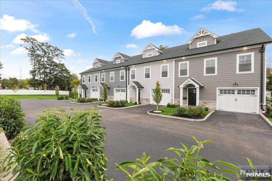 Welcome to this boutique new construction townhouse in the heart of Ramsey. This isn't just a home it's a lifestyle. Say goodbye to outdoor maintenance and step into a beautifully crafted space designed for ease and elegance. Located within walking distance of downtown Ramsey's restaurants, shops and nightlife and just a train ride away from NYC, this home offers unparalleled convenience. Upon entry, you'll find a spacious family room with a beverage bar, a covered patio, a powder room, laundry and access to an oversized garage with extra storage. Upstairs, an open-concept living room and kitchen await, featuring exquisite moldings, a large island and attention to detail. The dining area opens to a generous deck perfect for grilling. The primary suite includes double closets with high-end organizers and a luxurious bath. The top level offers two additional bedrooms, an office, a hall bath and a walk-in storage room. Opportunities like this don't come often begin your new life here