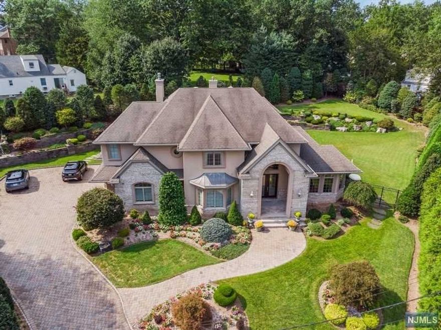 Look no more!!! Spectacular home takes luxury to a new level, located onone of Demarest's finest CUL DE SAC streets. This Beautiful Colonial offers, 2 story entry fyr flows into FLR, FR W/FP 1st FL BR suite and LNDY .The gourmet eat in kitchen included with Snaidero pininfarina design custom high gloss cherrywood cabinets, Calcutta Gold Honed marble counter tops and backsplash , Miele appliances, Sub zero ,convention oven, built in coffee maker, 5 burner cooktop, Coffee bar area with leather cabinets will Complete this impressive kitchen Breakfast area w/ sgds opening onto paver patio bbq and overlooking gorgeous landscaped property, 2nd FL offers A MBS,2 WIC and LG MBATH and FP,BR, BATH BR,BR BATH. Finish basement with den/office, gym and rec room. Quality throughout with meticulous attention to detail 3 car attached garage. Blue ribbon schools, 10 miles approx. to NYC. A must see !!!