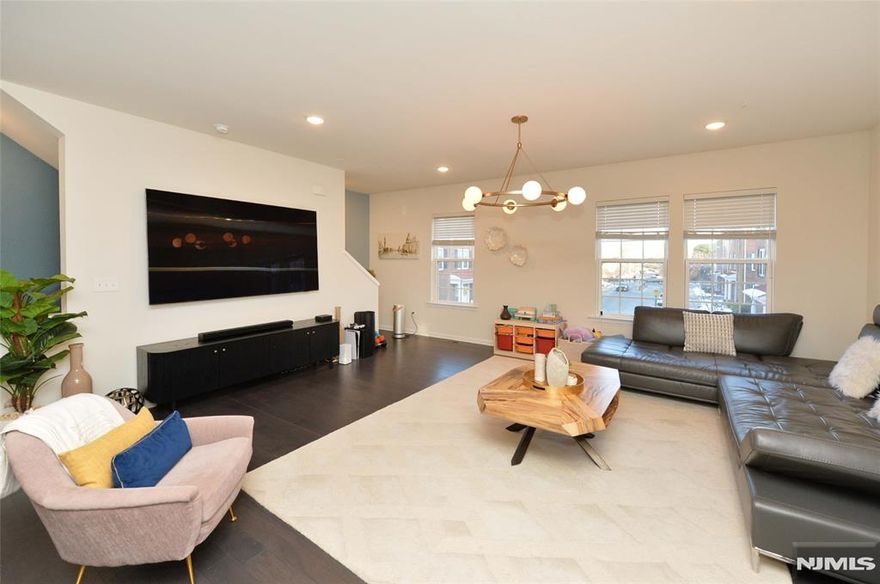 Welcome to this beautifully appointed 3-bedroom, 2 full bath, 1 powder room townhouse in Fair Lawns highly sought-after Crossing at Radburn community. Offering both comfort and convenience, this home allows you to pull directly into your private two-car garage or enter through an inviting foyer with seamless access to a spacious den or home office, ideal for guests, remote work, or flexible living. The main living level is bathed in natural light and features a generous open-concept layout where the living room, dining area, and modern eat-in kitchen flow effortlessly together perfect for both everyday living and entertaining. This level also includes a conveniently located powder room. Upstairs, the third level offers a serene primary bedroom suite with private ensuite bathroom , an additional large bedroom and hallway bathroom, a tastefully updated full bathroom, and a dedicated laundry room with easy access, adding to the home's thoughtful design. This is the perfect opportunity to own in one of Fair Lawn's most desirable communities and enjoy all the amenities, charm, and lifestyle the town has to offer. A true blend of space, style, and location, this home is not to be miss. This home is part of the Radburn Association in Fair Lawn, where homeowners pay quarterly dues and enjoy access to the exclusive Radburn section of town, including pools, parks, a community center, and much more.