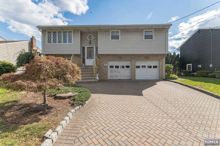 Welcome Home to your well maintained Bi-level on a quiet Cul-de-sac in Wood-Ridge. First floor features 3 bedrooms, full bath, kitchen, dining room, and formal living room. Ground level features Summer Kitchen, family room and full bath. Attached 2 car garage with driveway to hold 4 additional cars. Close proximity to Westmont (Wood-Ridge) Train Station.