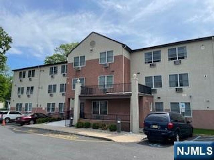 Well-maintained 1-bedroom apartment located on the first floor. Features include a kitchen with electric oven/range and refrigerator, A/C unit(s), a generously sized living room, and abundant closet space for storage. Building amenities include convenient laundry facilities in the basement, an elevator for easy access, and a peaceful setting designed for quiet, low-maintenance living. Tenant pays electric & heat. Conveniently located near shopping, restaurants, and public transportation, including NJ Transit bus stops and buses to NYC. Access Link Bus picks up in front of the building as well. No Pets, No smoking, very limited parking. Maximum occupancy is 2 people, no exceptions.