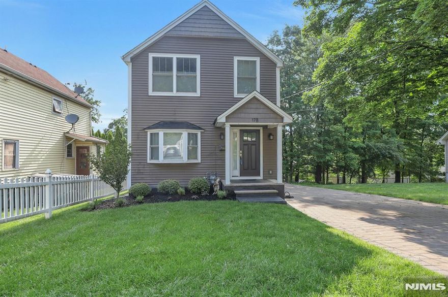 Classic Elegance! Completely renovated, charming Colonial. 3-bedroom in a quiet residential neighborhood, walking distance to downtown and just around the corner from Sapienza nature park! This home is historically charming in every way. Hardwood floors throughout main level. Formal living room has huge bay window, bringing in warm afternoon sun. Dining room is perfect for family dinners, open to high-end updated kitchen. Includes Thermador appliances and granite countertops, pantry closet plus a breakfast peninsula! Side door access to driveway for convenience! Upstairs are 3 spacious bedrooms, all with plush carpet. Laundry is upstairs too! Finished basement has stylish touches throughout, including wood accent wall and built-in bar in Family Room. Home Office has direct access to AMAZING backyard! HUGE muti-level paver patio has built-in fountain AND a firepit! Perfect for entertaining all summer! Deep property, very private. Long paver driveway, space for 6 cars. Excellent regional school district, easy walk to Pascack Valley High School too! This is your dream starter home or perfect for downsizing! Either way, there's nothing to do but move in! This house will FLY so don't miss it!