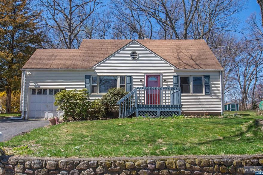 Charming Cape on Lovely Lot in Desirable Indian Lake! Move in & make it your own! So many great features. Dream home potential! HW Flooring on the first floor. Bright, Large living room - picture window provides tons of natural light. Open dining, perfect for entertaining. Functional, Eat-in Kitchen & sunroom off deck & back yard. Two bedrooms & a full bath compl the 1st floor. 2nd level offers another 2 generous sized bedrooms & a powder room! Multi-purpose space in basement; a real bonus! Both finished space for more living and unfinished for storage and laundry. Public utilities. New carpet! Nice yard for play & relaxation- an Unusual Find in Prime Location! Easy access to major highways and NYC Direct Transportation- train & bus! Just minutes from bustling Downtown with events, restaurants, shopping, etc! And LAKE LIFE- with membership enjoy all Indian Lake's clubhouse activities/events for all ages, beaches, boating, fishing & community JUST in time for Summer!