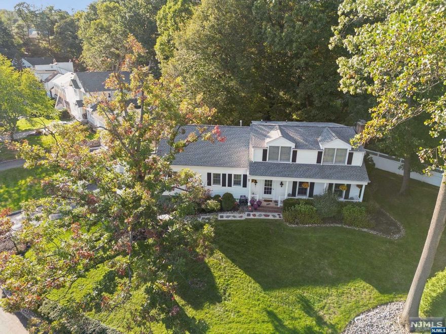 Spacious immaculately maintained 4 Bedroom Colonial with 4 Full Baths including 1st floor Primary Suite in ideal and convenient location! Nestled on a quiet cul de sac in the heart of the Glenwood section a few short blocks to top rated Glenwood Elementary School, Short Hills Train Station and Arboretum. Level park-like property, lovely outdoor entertaining spaces and terrific flow. Foyer flanked by the Formal Living Room and 1st floor Home Office / Guest Room. Living Room flows to Dining Room and stunning 4-years young Eat-In Kitchen with custom cabinetry, granite counters,and glass French sliders with direct access to Trex Deck + full hall Bathroom. Primary Suite with luxurious Primary Bathroom. 2nd level with large landing with access to oversized walk-in attic for potential expansion, 3 roomy bedrooms and updated full bathroom. Spacious Lower Level with Rec Room, oversized Laundry, wine cellar and storage rooms with direct access from mudroom to attached 2-car garage.