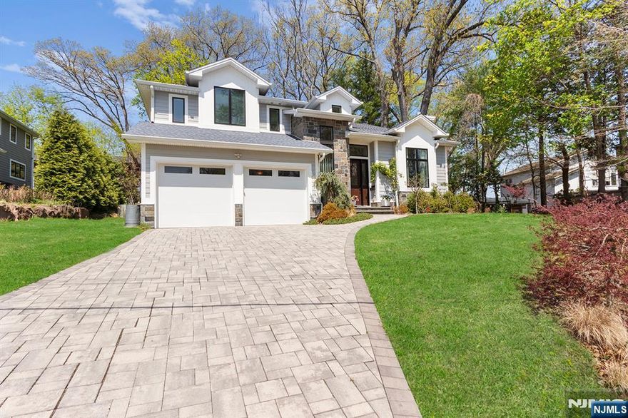 Nestled on a tranquil street in one of Cresskillâ€™s most sought-after neighborhoods, 67 Phelps Avenue is a meticulously crafted 6-bedroom, 5-bathroom contemporary residence offering unparalleled luxury and comfort. Built by a premier local builder, this home spans approximately 4,800 square feet and sits on a generous 0.55-acre lot. The expansive layout features a spacious living room, formal dining room, and a cozy family room with a fireplace, creating an inviting atmosphere for both relaxation and entertaining. A chef's custom-designed kitchen equipped with high-end stainless steel appliances, ample cabinetry, and large windows that provide a serene view of the rear yard. The primary suite boasts a walk-in closet and a spa-like en-suite bathroom, offering a private retreat. The home includes a guest suite and two additional bedrooms connected by a Jack-and-Jill bathroom, ensuring comfort and privacy for all family members. The full, finished basement features large windows, a home theater, a sitting area, an additional bedroom, and a full bathroom, providing versatile space for various needs. Attached 2-Car Garage, conveniently located with direct access to the home. Beautifully maintained with an underground sprinkler system, enhancing curb appeal. Equipped with central vacuum, security system, recessed lighting, and a generator hookup. Situated in a quiet neighborhood, this home is within close proximity to top-rated schools and offers easy access to NYC transportation,