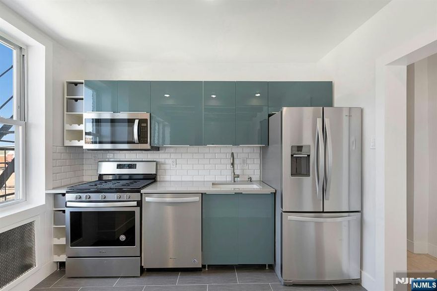 Beautifully Renovated bright apartment with European flair. This home features high ceilings, exposed beams, hardwood floors throughout, large modern kitchen, stainless steel appliances, and breakfast bar. Plenty of storage. Large primary bedroom. Fully outfitted closet. energy saving and LED lighting throughout. Remote controlled ceiling fans. Laundry Room conveniently located in building. Great location - Close to shops and trendy North Bergen restaurants. 1 block to Blvd East and transportation to NYC.