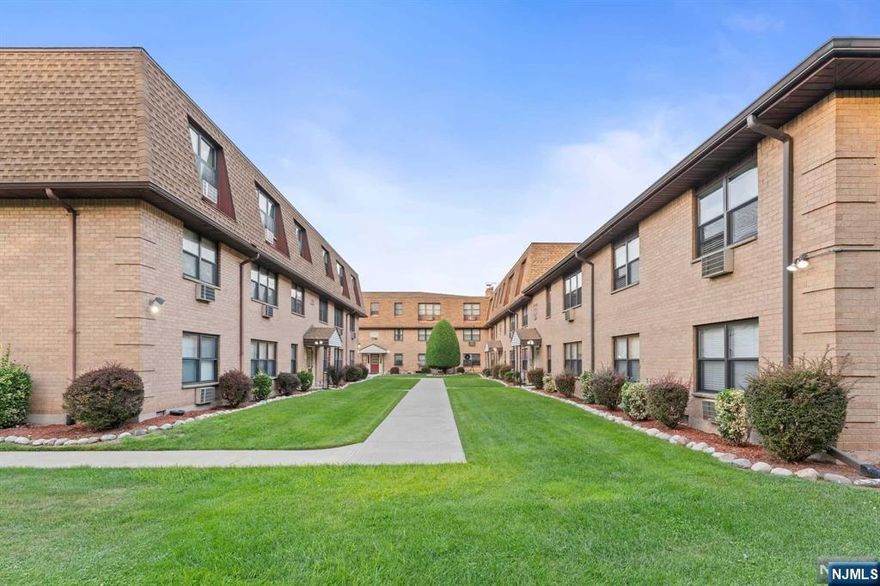 Opportunity knocks with this charming, spacious, and updated 2-bedroom, 1-bath condo (1,013 sq. ft.) in the peaceful North End Village community. This unit features beautiful hardwood floors and brand-new carpet, a bathroom with a Jacuzzi, and a kitchen equipped with newer appliances, including a dishwasher and stainless steel refrigerator. Ample closet space, new windows, and a new intercom system add to the convenience. The HOA fee includes heat, water, gas, free laundry, and two assigned parking spaces. Enjoy the well-kept grounds with a BBQ area ideal for entertaining and relaxing outdoors. The NYC bus stop is just around the corner, plus there's a shuttle to Secaucus Junction. Take advantage of low property taxes and maintenance fees!