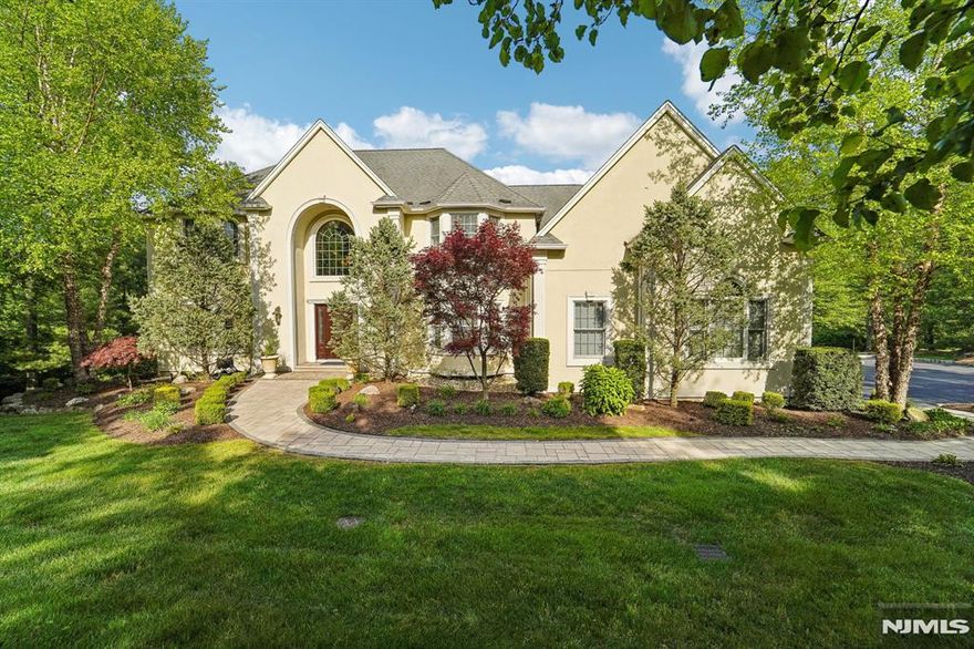 Stunning Colonial nestled on 2 professionally landscaped acres features a grand two-story Entry Foyer with dual closets, Formal Dining room and Modern Eat-in kitchen with a center island, granite countertops and backsplash, high-end appliances including a built-in KitchenAid refrigerator and 6-burner stove, and separate Dining area with sliders to a spacious Trex deck. The kitchen opens to the large Family room with gas fireplace, and the main level is completed by the Living room, Office, Full Bathroom, and Laundry room. Upstairs offers three generously sized Bedrooms, Full Bathroom, and a luxurious Master Bedroom Suite with two walk-in closets, a Sitting room, Office, and spa-like Master Bathroom with a jetted tub and separate stall shower. The finished walkout Basement includes a Rec room, Game room, Gym, and is plumbed for an additional Bathroom. Additional highlights include 9' ceilings, hardwood floors, custom trim and molding, chandelier lift, generator hookup, new water heater, alarm system on all windows and doors, with CAT5-wired 4K cameras, an oversized 3-car garage, expanded driveway and 12' x 16' storage shed. Outdoor living is elevated with the new enlarged deck with LED lighting, grilling area, under-deck patio, fire pit, and underground sprinklers, offering exceptional amenities for year-round enjoyment!