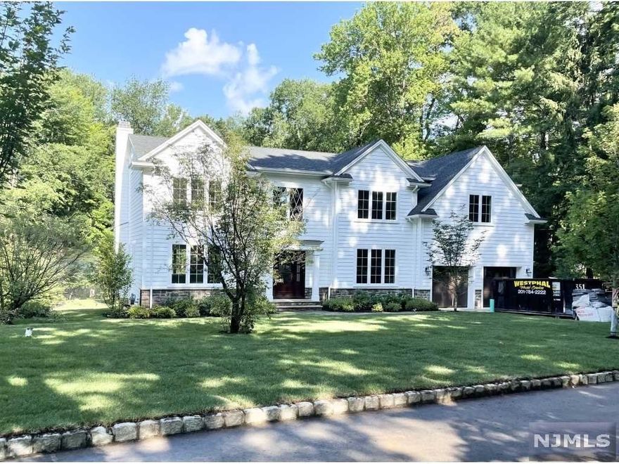 NEW CONSTRUCTION. 5 bedrooms, 4.5 bath home on quiet dead end street. Flat lot, wooded rear yard, private setting. Close to elementary school and Woodcliff Lake middle school. 3 levels. Grand 2 story foyer, living room, dining room, magnificent kitchen, custom cabinetry quartz counters, stainless steel appliances, family room, fireplace, 1st floor office/guest bedroom, master suite with 2 oversized custom closets, laundry on 2nd floor, full finished basement with detailed office, playroom, gym, recessed lighting, 5' plank floors, elegant moldings, alarm system, paver driveway, bluestone patio sprinklers, fully landscaped property... MUST SEE!