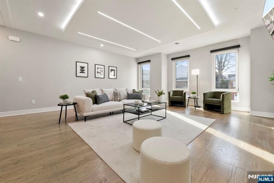 Experience Luxury, Convenience, and Lifestyle within minutes from NYC, Amazing Restaurants, and Shopping. New Construction Townhouse style home featuring World-Class Design and Finishes. The home features open concept layout, high ceilings, and perfect for gatherings and entertaining. Chef-style kitchen featuring black quartz counters with high-end Jenn-Air appliances. Primary bedroom suite with walk-in closet, additional bedrooms, and convenience of same floor in-unit washer & dryer. An stunning rooftop loft with wet bar leading to a rooftop trex deck with NYC skyline views. Glass railings, water softener and filtration system, custom millwork and storage, central vacuum, and state of the art golf simulator screen or theatre screen, motorized window treatments are a few added features to amplify the living experience. NYC transit & Montessori school at your door step, private car garage, downtown eateries and waterfront shopping encompass the Lifestyle of Luxury and Convenience.