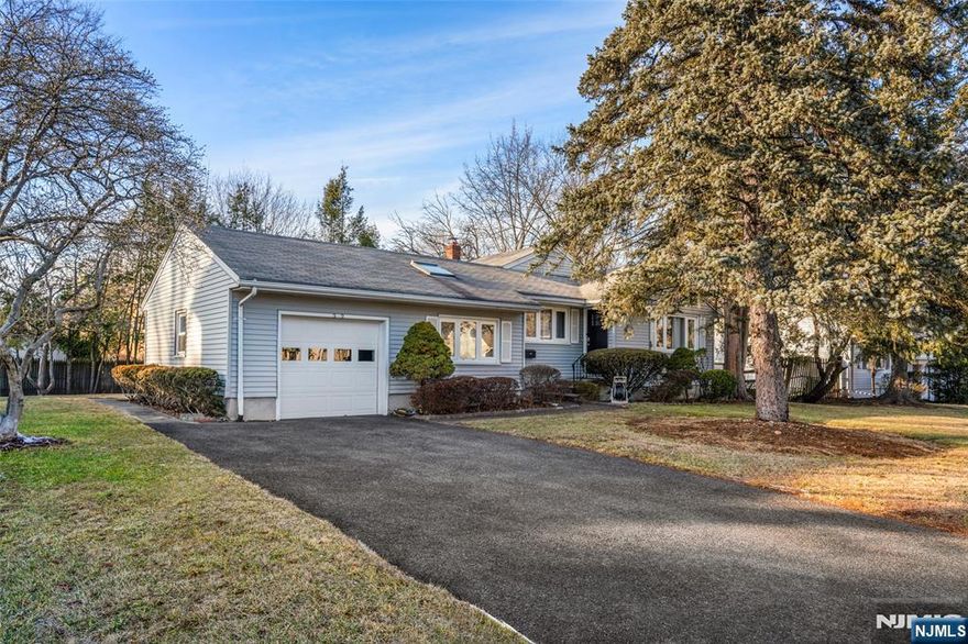 Welcome to this beautifully maintained 3-bedroom, 2.5-bath Ranch offering a perfect blend of comfort and convenience. The spacious living room, dining room, and family room enhanced by a skylight, create a bright and inviting atmosphere. The kitchen with skylight adds to the home's airy feel. The primary suite features its own updated full bath, complemented by two additional bedrooms, a second updated full bath, and a powder room. Hardwood floors and new recessed lighting throughout the home, adding elegance and warmth. The full basement provides ample space with a recreational area, room/den, storage, and laundry room. Additional highlights include updated bathrooms, new doors, central air conditioning & heat, and 1-car attached garage. Enjoy outdoor living in the private backyard, perfect for relaxation or entertaining. Conveniently located near schools, parks, downtown shopping, and NYC transportation.