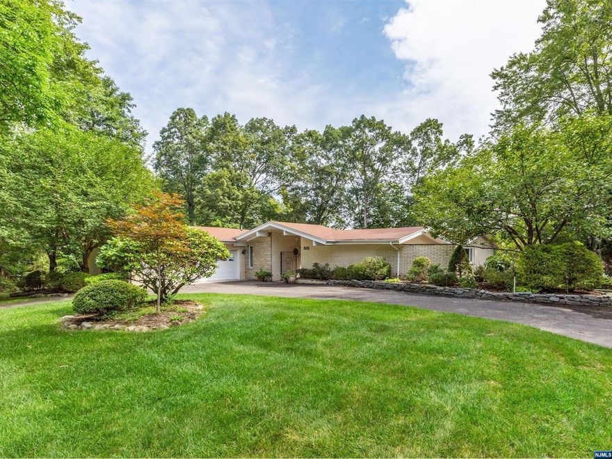This 4 bedroom/3.5 bath Mid-Century Modern Ranch Style home located in desirable Franklin Lakes is all that and MORE! Nestled on over an acre of gorgeous grounds with gunite in-ground pool, additional features include: updated kitchen with granite countertops and breakfast bar, master bedroom suite with updated full bath & walk-in closet both with radiant heat and fully finished walk-out basement with wet bar and family room. The invisible doggie fence runs the perimeter of the property, making the family fur baby a happy pooch! Whatever the weather, this home was built for gracious entertaining for all.