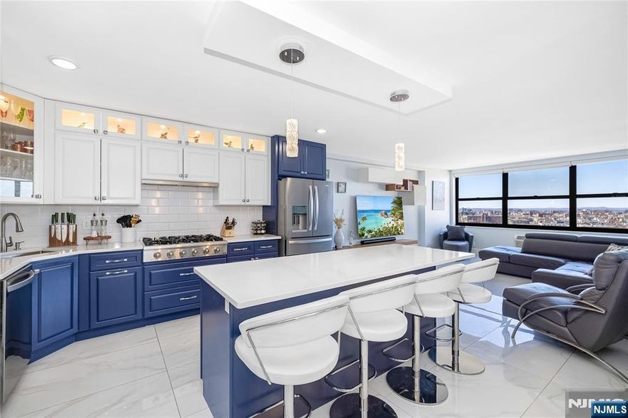 Experience upscale living in this expansive 1,337 sq. ft. condo located in Guttenberg, NJ. This beautifully remodeled 2-bedroom, 2-bathroom residence offers sweeping river views from every room, creating a peaceful and impressive backdrop for daily living. The thoughtfully designed open layout is ideal for both relaxing and entertaining, featuring a fully renovated kitchen with a large center island perfect for hosting. Refined finishes, enhance the homeâ€™s elegant feel, while the primary bedroom features a spacious walk-in closet and the secondary bedroom offers ample storage. Residents enjoy resort-style amenities, including indoor and outdoor pools, modern fitness centers, a full-service spa, tennis and pickleball courts, game and play rooms, and a resident lounge with stunning NYC views ideal for private events. A tranquil garden and on-site shopping mall add ease and comfort to daily life. This is a rare opportunity to own in one of Guttenbergâ€™s most sought-after buildings. Galaxy Towers offers all-inclusive utilities, optional parking, 24-hour concierge and security, and convenient access to Manhattan via bus or ferry, delivering a lifestyle that seamlessly blends luxury, comfort, and accessibility.