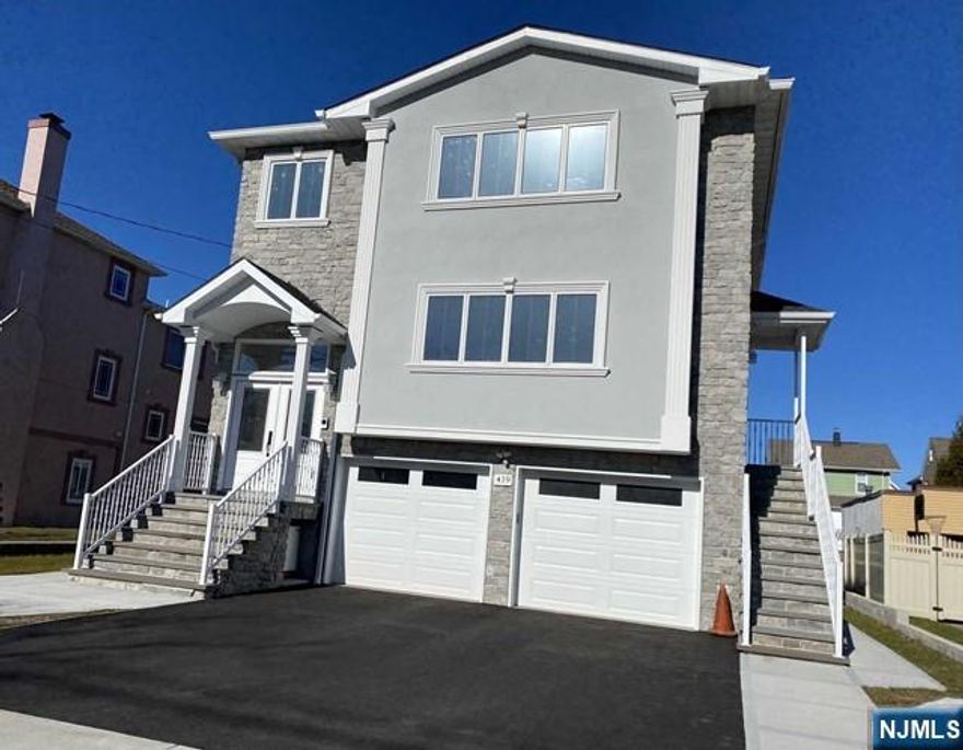 Spacious new construction 3 bedroom, 2 full bath second floor apartment. An open floor plan with living room, dining area and large, modern eat-it kitchen, granite counters, tile back splash and dishwasher. Features a master bedroom with master bath, laundry in unit with washer/dryer provided, recessed lights, hardwood and tile flooring throughout, baseboard hot water heat, central air condition. No pets of any breed. Super convenient location, just a block away from train station for easy commute to NYC.