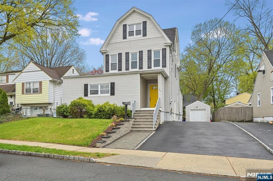 A fantastic opportunity to own a well-maintained and expanded two-family home on the east side of Dumont. The first-floor apartment offers a living room, dining room, kitchen, laundry room, two full baths, three bedrooms, including a spacious primary suite with sliding glass doors to a deck and private yard, perfect for relaxing or entertaining. The second-floor apartment is filled with natural light and features high ceilings, a living room, kitchen and bedroom, plus access to the third floor with two finished rooms ideal for a home office, den, guest space, or additional living area. Additional features include separate utilities, vinyl siding, basement storage, a widened driveway, and new front steps and walkway. Just steps to Grant School, Memorial Park, and NYC transportation. Perfect for a user or investor!