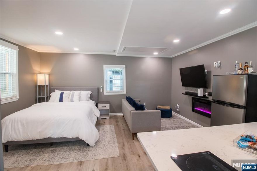 Rare opportunity to acquire a uniquely configured multi-income property in Irvington. Currently set up with FIVE separate living spaces, offering flexibility for investors, house hackers, or multigenerational buyers. The main building features: Two 3-bedroom, 1-bathroom full apartments (One currently occupied & one delivered vacant) In addition, the property includes three additional income-producing spaces: A 2-bedroom, 1-bathroom full lower level apartment and a private single-room suite with its own bathroom and kitchenette. Also, a converted studio apartment in the rear of the property. Every unit and space includes its own washer and dryer, a revenue generating amenity that supports strong rental appeal and premium pricing. With only one unit currently occupied, the next owner has the opportunity to reposition rents to market value, continue or expand short-term rental use, house hack and live in one unit while collecting income, accommodate extended or multigenerational living. This is not a cookie-cutter multi-family! It's a flexible income property designed for someone who understands how to maximize cash flow. Strong rental demand area with convenient access to transportation, shopping, and major routes.