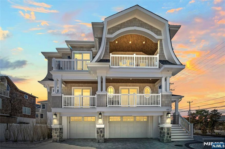 Welcome to this stunning oceanside custom residence in Harvey Cedars. Completed in 2023, this 3,000 SF home blends modern luxury with coastal charm, offering 5 bedrooms, 4.5 baths, an office, and 1,000 SF of decks including a rooftop with sweeping ocean and bay views. Built by JS Pro Construction, the home features a European kitchen with La Cornue range, Miele coffee maker, custom cabinetry, and dining deck with bay views. Its exterior showcases gorgeous NuCedar siding for timeless coastal appeal, while a glass enclosed elevator provides seamless access to all levels. Bathrooms are finished with curated slabs and mosaics. The open-concept living and dining area boasts a barrel ceiling, stone fireplace, and dramatic NanaWall opening to an outdoor lounge with Phantom Screens. The primary suite includes a private balcony and spa-like bathroom, while guests enjoy ensuite bedrooms, bunk rooms, a family room, and private office. Outdoor living shines with a saltwater pool, bar, outdoor kitchen, dining, and TV lounge. Perfect as a retreat or investment, the home rents for $21,000/week in peak season and offers easy access to dining, shops, and the best of Harvey Cedars living.