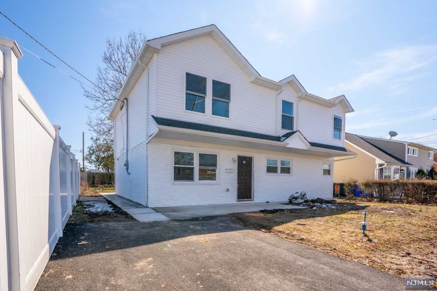 Striking newly fully renovated Bi-Level home featuring 5 Spacious Bedrooms, 3 full bathrooms, central air and heat, large backyard with 2 car driveway. Upon entering, you will appreciate utilizing the dining room and renovated kitchen. Afterwards, you will experience the ambiance of crown molding, hardwood flooring, fresh paint, bright and open floor plan which seamlessly connects to the living room, dining room and kitchen. Meticulous attention to detail presented in the kitchen with new quartz countertops and customized back splash. Enjoy the indoor/ outdoor living which leads out onto a large backyard area. Commuters dream home since its steps away from NYC bus line.