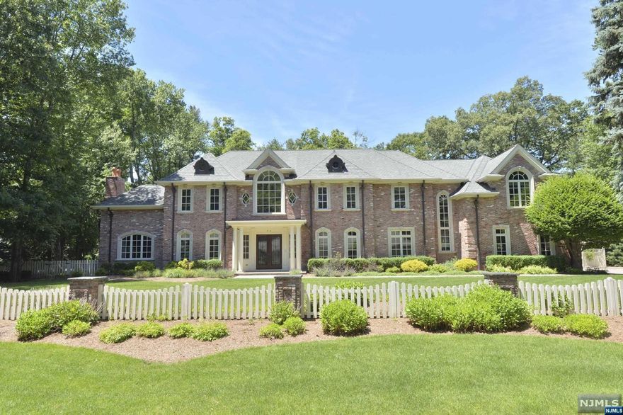 2005 all brick manor by L & L builders is ready to move in. No expense spared on a premier lot backed by preserved land on multi-million $ sought after street. State of the art finishings including reclaimed French limestone foyer entry, circular stairs, cherry floors, coffered ceilings, and fabulous upgrades including kitchen, baths, master bedroom closets, and amenities too numerous to list. The exterior grounds are beautifully landscaped, and offer a koi pond, potting shed, inground heated pool, cabana and pergola. 4 car garage. Pool is separately fenced and surrounded by brick stanchions. Great floorplan for working remotely and entertaining.