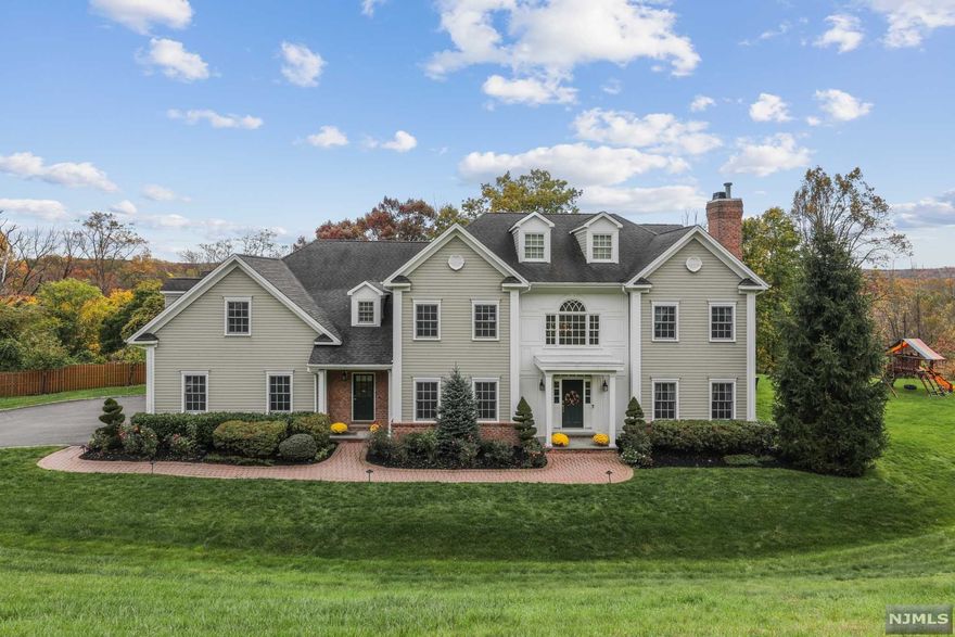 Stunning 2005 Center Hall Colonial, dual staircases, Beautifully finished 4 levels, large formal living room and dining room, spacious bedrooms, exceptional leisure space, Interior features include Hard Wood floors with in-lay, built-ins, crown moldings, recessed lights, window seats. Dream Chef's kitchen with door to patio, open to Two Story Great Room, covered porch, 1st floor Bedroom and full bath. 2nd level: 4 BRs most walk-in Calif Closets; Master BR Suite, En-Suite Bedroom, Jack & Jill Bedroom, office, large laundry room. 3rd level: large office. Lower Level includes a Media Room with equipment, Games Room, Yoga/Home Gym/Dance Room, Private Office, full Bath & Flex rooms. Perfect Stay-Cation Home! Beautifully landscaped, cul-de-sac, 3-car garage, security system, sprinkler system, see Amenities List