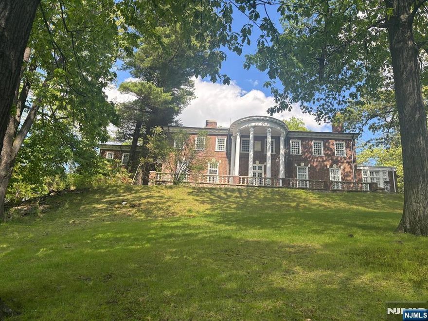 This gorgeous 5 bedroom 5 1/2 bath all brick Georgian Mansion is set on over 2 acres on one of the most beautiful streets on the East hill of Englewood. This home offers 11 foot ceilings, beautiful hardwood floors, large palladian windows with magnificent Western views ,5 fireplaces and grand rooms throughout. First floor has large entry hall ,banquet sized dining room, library, living room, sunroom and grand modern spacious updated kitchen. Second floor has primary suite with primary bathroom and three additional bedrooms .Close to houses of worship, downtown Englewood and transportation. Just 6 miles from NYC .