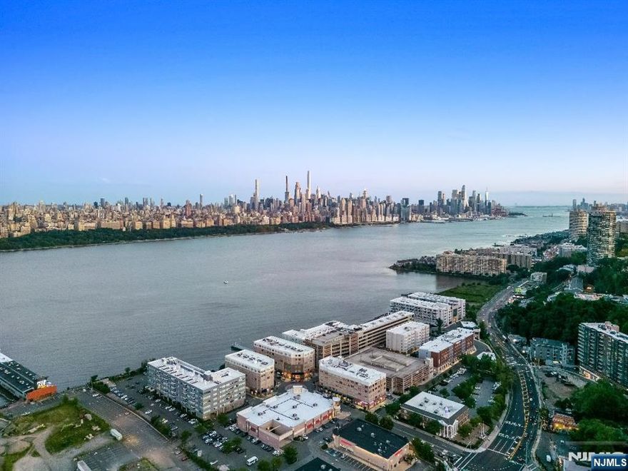 Perched high on a cliff, this exceptional 3-bedroom, 2-bath apartment approximately 2,000 square feet with a 1,000 square foot balcony offers the ultimate blend of luxury, privacy, and breathtaking scenery. Featuring a rare wraparound balcony, you'll enjoy unobstructed, panoramic views of the iconic New York City skylineâ€”day or night, the vista is simply unforgettable. Inside, the spacious open-concept layout is flooded with natural light from floor-to-ceiling windows, seamlessly connecting indoor and outdoor living. The modern kitchen is equipped with premium appliances and sleek finishes, perfect for both quiet nights in and entertaining guests. The primary suite boasts direct balcony access, an en-suite bathroom, and serene views to wake up to each morning. Two additional well-sized bedrooms and a second full bath. Laundry is in unit and also one car attached garage parking and one outdoor parking spot. Set in an exclusive, quiet location yet just minutes from the city, this apartment is a rare opportunity to live above it allâ€”private, dramatic, and unforgettable.