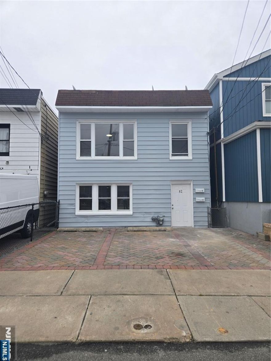 Fantastic renovated 2-family home in Fairview. The first level features a brand-new kitchen and bathroom with custom cabinetry, onyx countertops, and new stainless steel appliances. Both units boast new flooring and fresh interior and exterior paint. Move-in ready and conveniently located just one block from NYC transit. Includes parking for three cars and a beautiful backyard. Call today!