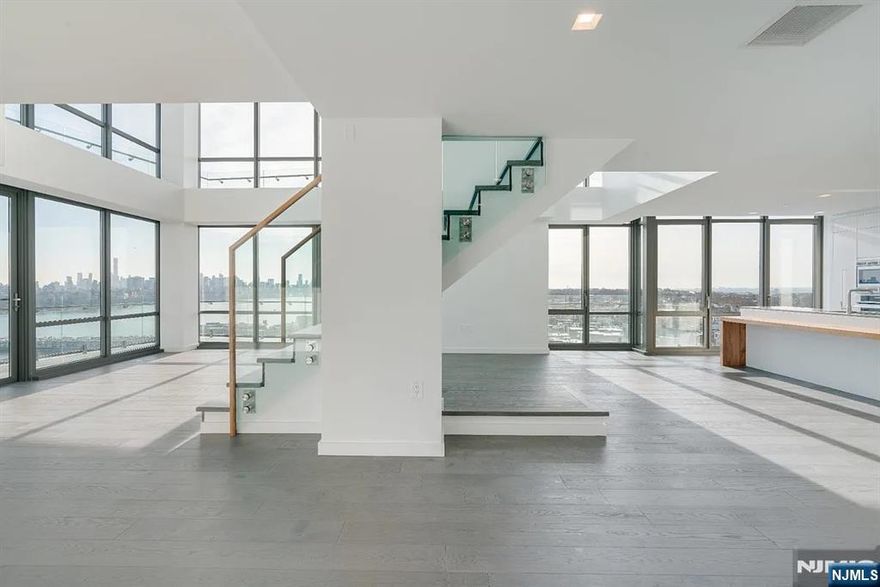 Spectacular Penthouse Duplex with Panoramic Manhattan Views at One Park Condos Experience unmatched sophistication and sweeping south/east-facing views of Midtown Manhattan from this extraordinary 4-bedroom, 3-bath penthouse duplex at One Park Condos, one of North Jerseyâ€™s premier full-service buildings. Spanning two elegant levels, this residence showcases two spacious primary en-suites, an open-concept layout, and 7â€ white oak engineered hardwood floors complemented by custom millwork and designer finishes. Floor-to-ceiling windows and a wrap-around private balcony bathe the home in natural light, offering a seamless connection to the iconic skylineâ€”perfect for tranquil mornings or glittering city nights. The chef-inspired kitchen features Thermador Pro Series stainless steel appliances, polished Cielo Quartzite countertops and backsplash, and custom white lacquer cabinetry with under-cabinet lighting. Motorized window treatments add effortless comfort, while spa-like baths create a true sanctuary. Residents enjoy access to over 25,000 square feet of resort-style amenities, including a 24/7 concierge, indoor pool, state-of-the-art fitness center, and moreâ€”delivering an unparalleled lifestyle of luxury and convenience. With a tenant in place through the lease term, this exceptional penthouse offers both premium living and a strong investment opportunity in one of the most desirable addresses along the Hudson River.