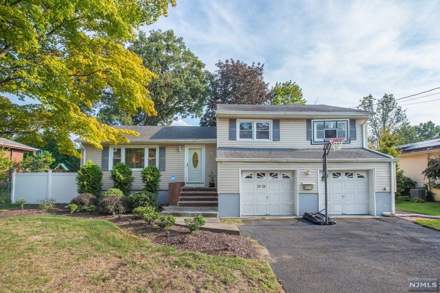 Beautiful well maintained home with hardwood floors throughout the home. Walk into the main floor with a large living room, spacious dining room, Eat in Kitchen with newer stainless steel appliances. The second floor features a Master bedroom with an updated bathroom, 2 bedrooms and updated main bath. The lower level has a powder room, family room with door to fenced back yard, 2 car garage and entry to basement. New hot water heater (May 2021), new Central Air (July 2021). Bathrooms renovated 2019, fence installed 2020, motion detector floodlights, water softener. Close to transportation, highways.