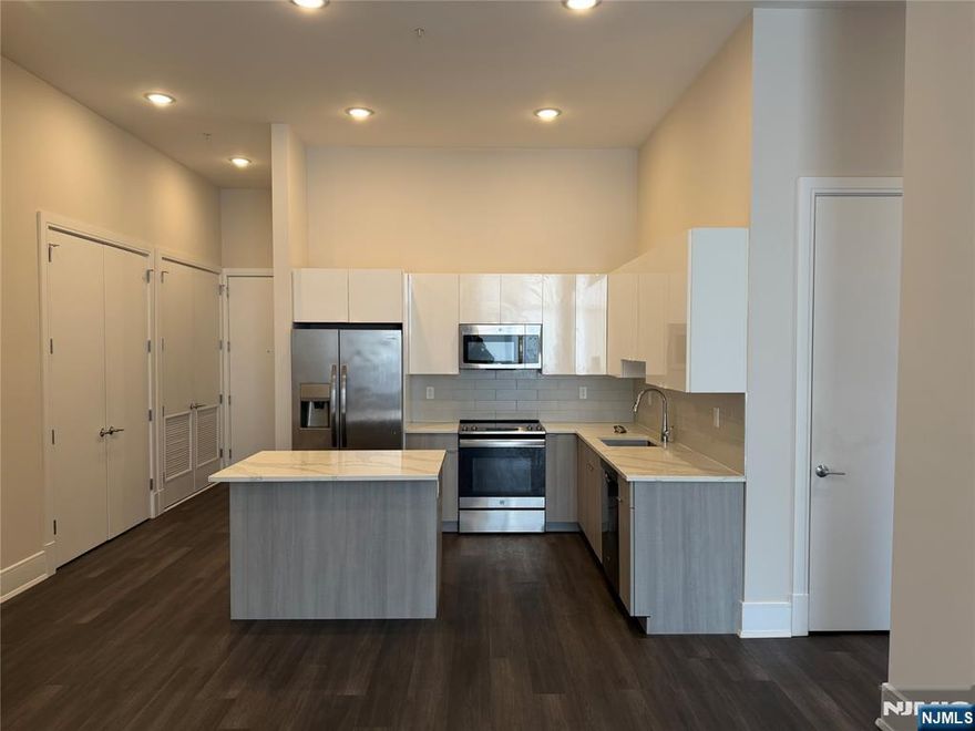 **FIRST MONTH FREE on a 13-month lease + one parking space included! - for occupancy commencing on or before 4/1/26!** Welcome to the Metro, Fort Lee's newest luxury building. All amenities INCLUDED in the rent, and REDUCED rent security offered to qualified applicants - The Metro features a variety of upscale, spacious floorplans. high-end residences fully equipped w/ modern kitchens w/ stainless steel appliances, quartz countertops, full islands & tiled backsplashes, open living/dining areas, shades on all windows, modern bathrooms & a full-sized washer & dryer in each unit. The Metro features a large elegant lobby, outdoor courtyard, outdoor terrace/garden, large club room and a on-site fitness center, which includes the Echelon Reflect mirror, electric car charging stations & INDOOR (covered) parking garage w/ direct elevator access to all residences for uncompromising security. Pet friendly (LB limit & fees apply)! Tenants pay ALL utilities! PARKING: 1st space INCLUDED IN THE RENT(!); Additional space - $150/monthly! Virtual tour available upon request!