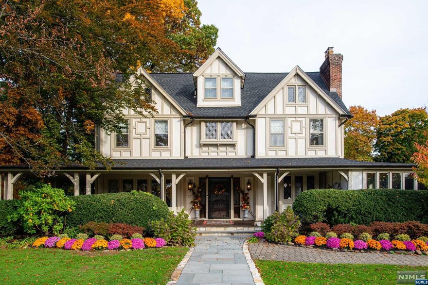 Your new home awaits on one of Glen Ridge's best blocks in town! Enter this lovely, historic Tudor-style home built after 1900 that exudes warmth and style. A fabulous house for entertaining with an open floor plan and high ceilings creates a harmonious flow throughout this beautifully-designed house. A new custom kitchen installed with high-end appliances, a 10' x 6' marble eat-in kitchen island, and Pella floor-to-ceiling bi-fold doors opens to a stunning custom stone patio. Boasting endless upgrades and original details, this stately home has 7 impressively large bedrooms, 4 full baths, 2 half baths, and a partially finished basement set upon a beautifully landscaped half acre of land. NYC trains, top rated schools, nearby award-winning restaurants all await and welcome you to the charming town of Glen Ridge.