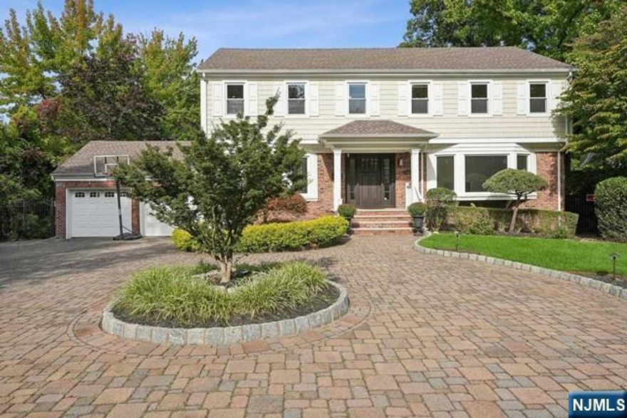 Move right into this beautifully renovated 4 Bedroom, 2.5 Bath Center Hall Colonial, set on a private, beautifully landscaped property featuring a free-form gunite pool. Every detail of this home has been meticulously updated, offering spacious, light-filled rooms and a walk-out basement. The freshly painted interior features a modern gourmet kitchen, fully updated bathrooms, newer windows, and wide plank hardwood flooring. Outside, enjoy many upgraded features, including a paver driveway and patio, expansive deck, newer siding and roof, and an upgraded heating system. Located just minutes from NYC, major highways, and top-tier shopping, this home offers luxury living with exceptional convenience. Don't miss the chance to call this turnkey property your own!