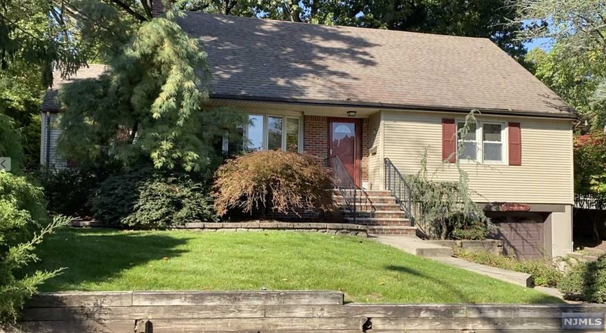 Location and space. This storybook Cape Cod has both at 2112 taxable sf with side street location steps from schools, parks and quaint downtown. The first level has the living room, den with sliders to patio, dining room, eat-in-kitchen with access to expansive deck, primary bedroom with two closets, an additional bedroom, coat closet plus three additional hall closets. The second level offers spacious landing with two bedrooms and full bath. Basement, with access to attached garage, has high ceiling, laundry area and mechanicals waiting for your imagination. Needs some TLC but has plenty of extras - air conditioning, in ground sprinklers, double pane windows, automatic garage door opener, room for 3 cars in driveway, expansive rear deck, mature plantings. 8 miles to GWB. Home offered 'as is'.