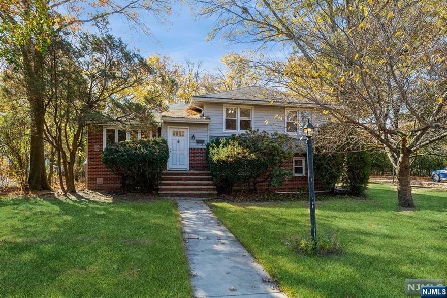 BRIGHT AND SPACIOUS SPLIT LEVEL ON QUIET RESIDENTIAL STREET IN HIGHLY DESIRABLE RIDGEWOOD SCHOOL DISTRICT. MAIN LEVEL HAS ENTRY FOYER, LARGE LIVING ROOM, FORMAL DINING ROOM, EAT IN KITCHEN AND ENCLOSED PORCH. LOWER LEVEL FEATURES LARGE FAMILY ROOM, FULL BATH AND ACCESS TO PATIO AND BACK YARD. THREE UPSTAIRS BEDROOMS AND A FULL BATH. LARGE UNFINISHED BASEMENT FOR STORAGE, UTILITIES AND PLENTY OF POTENTIAL. CENTRAL AIR. DETACHED 2 CAR GARAGE. SHORT DISTANCE TO TRAIN AND EXPRESS BUS TO N.Y.C.