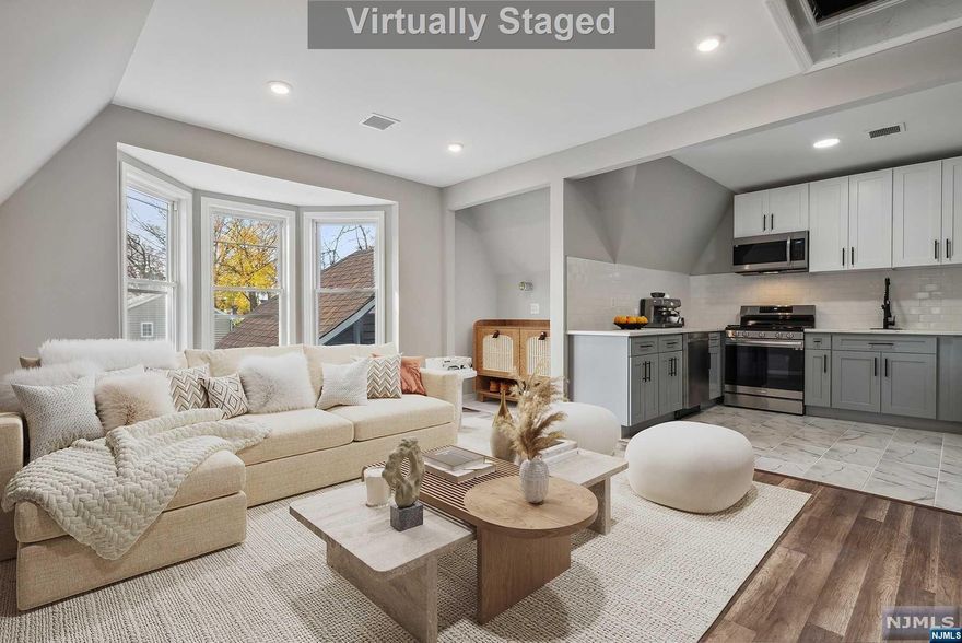 Nestled in the heart of Englewood, this 2 family stands as a testament to meticulous renovation & contemporary living. Recently renovated, presenting modern amenities & convenience. The kitchens features Custom 2-tone modern cabinets, quartz counters, subway-tiled backsplash, pull-down faucets & stainless steel appliances. Central AC, recent replacements of the roof & newly installed siding. Indoor aesthetics are further enhanced by recessed lighting, providing a contemporary ambiance throughout. The convenience of in-unit laundry hookups in both units adds to the property's allure. Unit 1 features- 3 BRs, 2 baths, Unit 2 features 1 BR 1 Bath. 2-car garage & additional 2 parking spaces. Situated off Tenafly Rd, it enjoys proximity to schools, houses of worship, parks & public transportation, Downtown Englewood, with its array of restaurants, shops, groceries & entertainment.