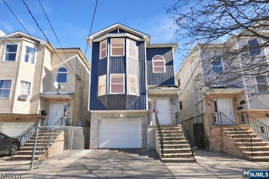 Welcome to this well-maintained multi-family home offering updated kitchens and modern bathrooms in both units. One unit features a unique duplex-style layout with bedrooms on two levels and a total of three full bathrooms, providing flexible living space and added convenience. The second unit offers 3 bedrooms and 2 full bathrooms with a functional and spacious layout. Both units include central air conditioning for year-round comfort. Additional highlights include an attached one-car garage and driveway parking for two vehicles. Conveniently located near major NYC commuter routes, public transportation, shopping, schools, and everyday amenities. This property presents an excellent opportunity for buyers seeking a multi-family home with updated interiors, parking, and easy access to New York City.