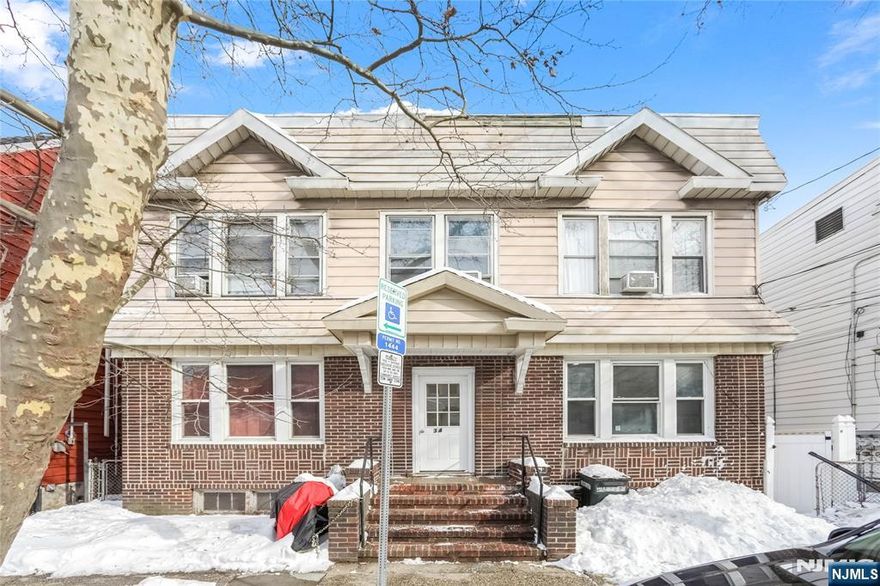 An exceptional investment opportunity this expansive and meticulously maintained 4-unit side-by-side duplex offers both timeless curb appeal and strong income potential. Showcasing a classic, symmetrical design, the property features a striking brick fa ade on the first level complemented by durable siding above, creating a clean and enduring exterior. Each of the four units is thoughtfully laid out across two stories, offering bright, airy interiors filled with natural light and highly functional floor plans that appeal to today's renters. With an established rent roll already in place, this property delivers immediate, reliable cash flow perfect for savvy investors or owner-occupants looking to live in one unit while generating income from the others. The inviting central entrance, highlighted by brick steps, adds to the property's welcoming presence, while sidewalk access ensures everyday convenience. Ideally situated on a residential block near public transportation, shopping, dining, and local amenities, this location supports consistent tenant demand. A rare chance to secure a solid, income-producing asset with long-term upside this is an opportunity you don't want to miss!