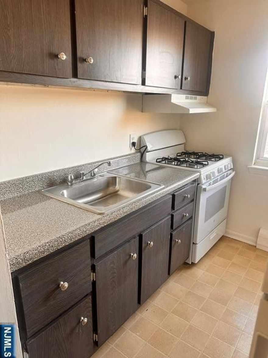 Well-maintained 1 bedroom 1 bath apartment located at Catherine Gardens. Rent includes one parking space, as well as heat, hot water, and gas. Conveniently located near public transportation, schools, dining, and shopping. Features a kitchen with a dining area, a spacious living room, a bedroom with ample closet space, and an updated bathroom.