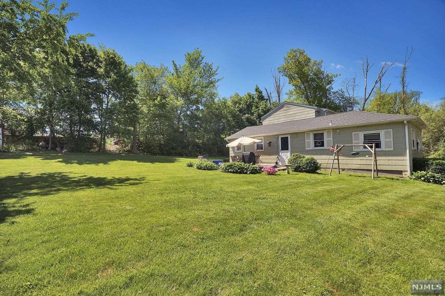 This 6 bedroom, 3 bathroom home located in Pinecliff Lake community, is not to be missed! The large oversized lot and location to center of town is unmatched! The first level hosts an open concept main living space, kitchen with loft ceiling, and breakfast area w/ direct access to patio and expansive yard, family room, 3 bedrooms, main hall bathroom, and primary bedroom w/en-suite with direct access to laundry/utility room. The second level has it's own separate entrance and boasts a bright and cheery bonus in-law suite! Complete with living room, kitchen w/ access to private deck, 2 bedrooms, and full hall bathroom. Newer roof. Optional lake membership. Bus transportation to all 3 schools! Home and detached shed are being sold strictly "as-is". Don't miss the opportunity to make this home yours!