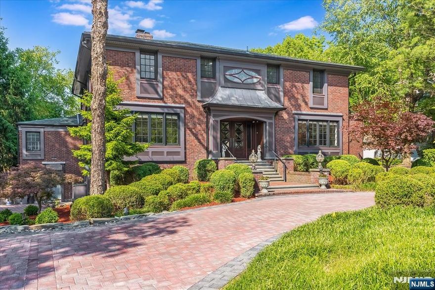 Contact Sarah Chung(201-788-9901) The Gem of North Cliffs! Thoughtfully updated between 2021 and 2023, this professionally designed home sits on a sun-filled, south-facing third of an acre in the prestigious North Cliffs. With quality finishes and low taxes, it offers a bright open floor plan with custom millwork, a spacious living room with dual-sided fireplace, and seamless flow into the family room and home officeâ€”all overlooking a beautifully landscaped, private yard. Outdoors, enjoy multiple dining and lounge areas, a dedicated play space, and a serene artificially constructed koi pondâ€”ideal for both relaxation and entertaining. The chefâ€™s kitchen features high-end appliances and a cozy breakfast nook. Upstairs, the primary suite includes a sitting area and spa-like bath. An en suite bedroom and two additional bedrooms with a shared bath complete the level. The redesigned lower level offers a family room, gym, bedroom, full bath, and office with direct yard access. Major improvements include new bathrooms, a new roof, boiler, instant hot water tank, and a newly paved extra-wide driveway for ample parking. This rare North Cliffs gem blends elegance, comfort, and convenience in one of Bergen Countyâ€™s most sought-after neighborhoods.