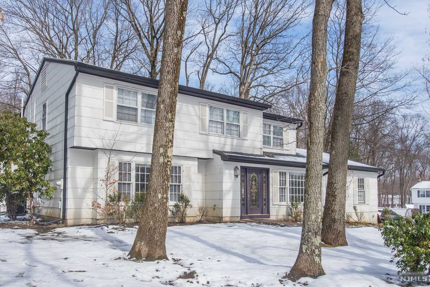 Location! Location! Location! Center Hall Colonial that boasts over 3100 sq ft of living space, nestled on corner lot of quiet treelined cul-de-sac. Located in desirable Nestling Wood Neighborhood, featuring massive size rooms and a flexible floor plan. Sunny eat-in kitchen with SS Thermador dishwasher and range, huge LG SS refrigerator, and granite countertops. Cozy oversized sunken family room. Great room and Sunroom features cathedral ceilings, skylights, fireplaces and sliders that leads to deck. House needs work! Most rooms are freshly painted. Deck needs repair and carpeting needs to be replaced. Sidewalks, All public utilities, and Great Schools. Room measurements are approximate. This Property being sold "As Is", no known defects but both fireplace chimney/flue(s) is "As Is". This is an Estate Sale, priced to sell!