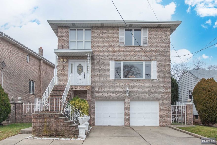 All brick over 2,800 SF side hall colonial in desirable Fort Lee location. 1st floor entry through a grand open foyer leads you to a bright living room and dining room with hardwood floors and oversized windows. Spacious kitchen has a brand new dishwasher and refrigerator; and access to a deck. Family room and powder room are also featured on the 1st floor. 2nd floor features master bedroom en-suite with full bath with jacuzzi tub. Two additional bedrooms are generous size with windows overlooking backyard. Main bathroom with a shower is also featured on the 2nd floor. The ground level features 2 car garage, mechanical room with 2018' hot water heater and 2021' heating furnace; laundry room and a large storage area with access to outside patio. The backyard is leveled, landscaped and fully fenced. This home is freshly painted and ready for your new vision. Conveniently located to shopping, restaurants, NYC commute and only steps away from school #4, park and playground.