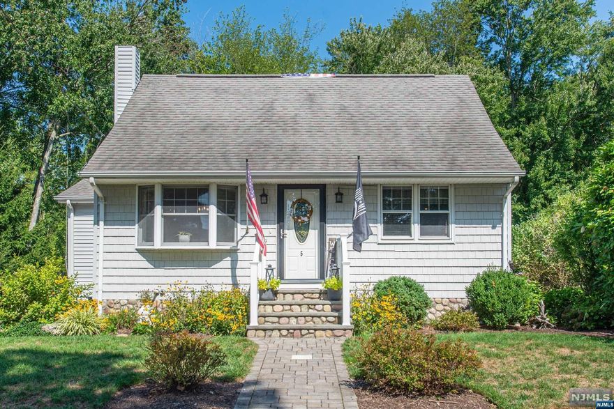 Beautiful Cape in a quiet neighborhood. Enjoy the large country kitchen while looking out over the spacious deck and the secluded backyard. Large living room with custom built in and an updated dining, perfect for entertaining. Solid Oak flooring throughout upstairs and down, tiled bathrooms and kitchen. Partially finished basement can be a bonus room or act as a home office. Don't miss out on this great opportunity to get into one of the most desirable neighborhoods in Bloomingdale, an American small town.