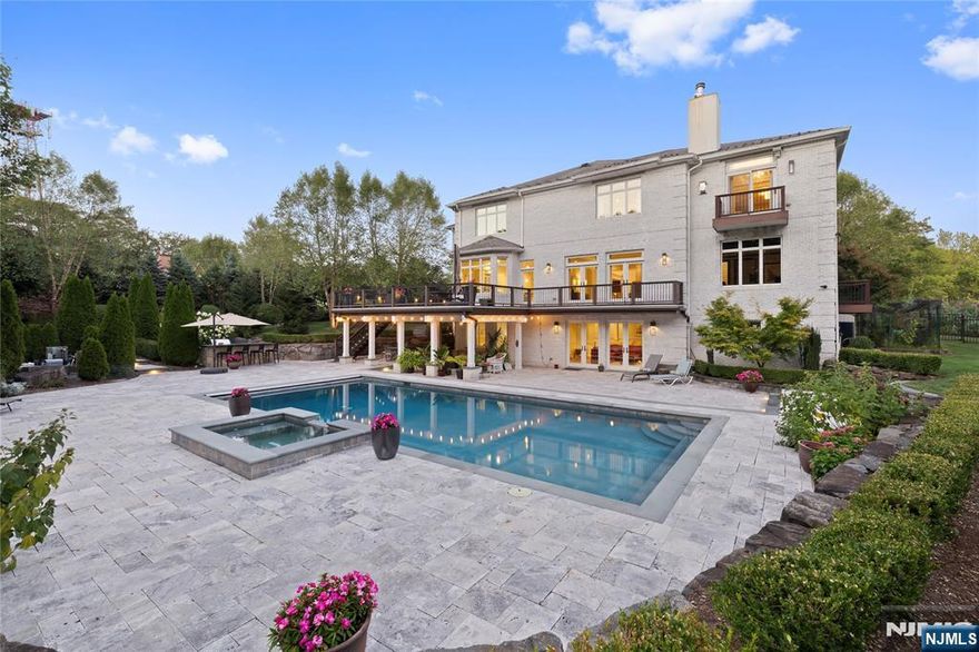 Welcome to La Casa Royale (417 Route 9W, Alpine, NJ), a rare opportunity to own a custom-built gated luxury estate that blends timeless elegance with cutting-edge technology. Designed by the owner for his own family, this 10,800 sq. ft. (total) residence offers both grandeur and warmth, with thoughtful details at every turn. From the moment you step into the soaring foyer beneath a sparkling chandelier, youâ€™ll feel the craftsmanship and attention to detail. The Smallbone kitchen, fitted with Subzero and Wolf appliances, is a culinary haven, while the expansive dining and living rooms are made for gatherings both formal and casual. This smart home features 7 bedrooms and 6.5 baths, including a primary suite with 16â€™ ceilings, spa-like bath, and multiple walk-in closets. Entertainment is effortless with a movie theater, full bar, wine fridge, home gym, sauna, and steam shower. Outdoors, the property becomes a private resort: a 45â€™ saltwater pool, jacuzzi spa, outdoor kitchen, and Ipe deck all framed by 2.34 acres of mature landscaping and a bocce court & koi pond. Located in prestigious Alpine, just minutes from Manhattan, this estate is the ultimate NYC commuter retreat for professionals and families who love to entertain in style, with nearby hiking trails and scenic lookouts, cycling along iconic Route 9W, and access to Alpineâ€™s highly rated schools.