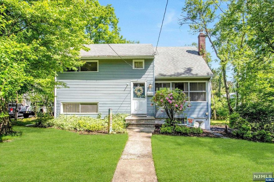 Lovely Home on lush property in the Heart of Harrington Park! Family has loved, and lived in this home for many years! Welcoming foyer leads into a large and bright formal living room with a wall-of windows. Full bath also on this level. A few steps down you will find a spacious dining room, open to the bright, well-maintained eat-in kitchen with a breakfast bar/peninsula. A large den, off of the kitchen, includes access to the backyard. The second level features two spacious bedrooms. The third level offers a large bedroom and full bath. On the ground level you find a spacious laundry area and the garage. Wonderful property with a large backyard and deck, great for entertaining. 2-car attached garage with a generous-sized driveway. Close to schools and parks!