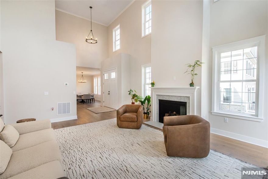 Almost new end-unit townhome in the Enclave at Hillandale. This is the largest model with nearly 4500 sq. ft. of space, in a premium location; private, along with gorgeous sunrise and mountain views. Special features include a gourmet kitchen with oversized center island, butler's pantry, first floor master suite with customized walk-in, designated home-office area with French doors, two-story great room with gas fireplace, deck, second floor loft/rec room, 3 additional bedrooms all with private full bathrooms and walk-in closets, a finished walk-out basement, ground-level patio area, multi-zone heating & AC, and oversized garage.