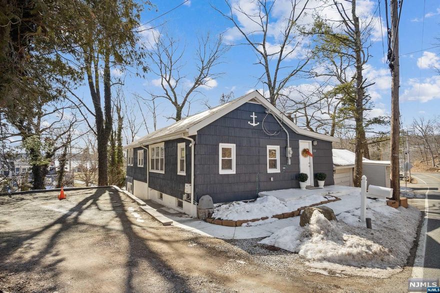 Welcome to your dream home in the heart of the picturesque lake community of Lake Hopatcong! This fully renovated 3-bedroom, 1-bathroom house boasts modern amenities and scenic views, making it ideal for tranquil living or entertaining guests. Step inside to discover brand new laminate flooring throughout, complemented by stainless steel appliances and quartz countertops in the kitchen and an open concept between the dining room and the family room. The spacious family room provides a cozy retreat, while the ground level features a large partially finished multipurpose room, perfect for entertaining or additional living space. With brand new 200amp electricity, high-end septic system, roof, and well tank, convenience meets peace of mind. Outside, an elevated deck and concrete patio beckon for outdoor gatherings. Whether seeking a vacation oasis, Airbnb investment, or permanent residence, this property offers the perfect blend of comfort, convenience and charm!