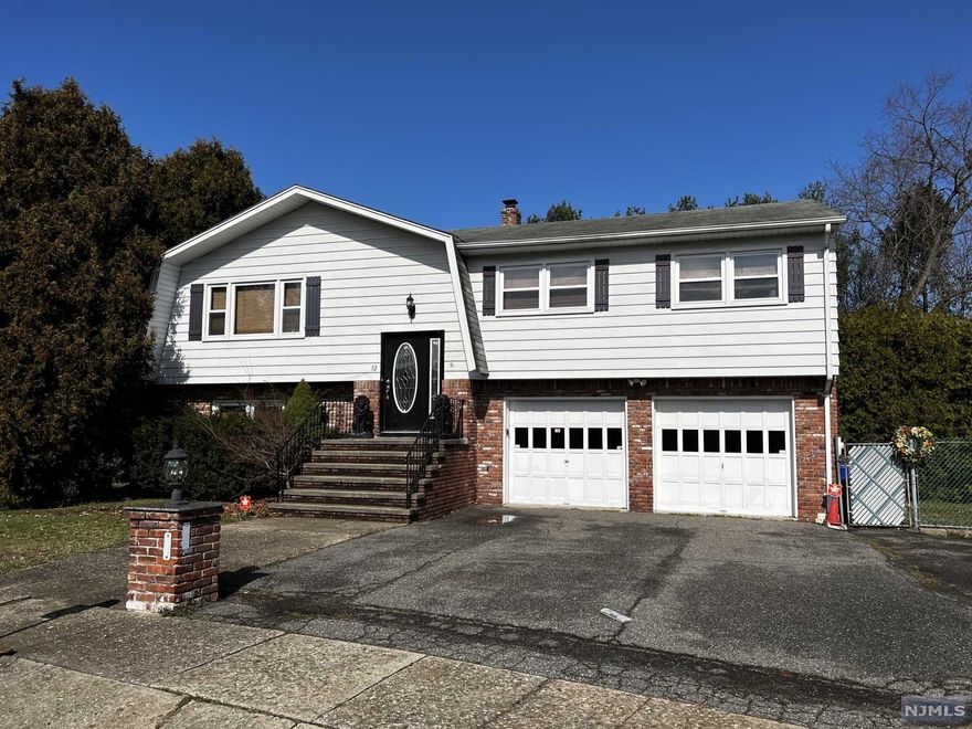 Bi-Level - Move in condition- features hardwood flooring throughout- updated kitchen with stainless steel appliances / granite- tons of cabinets- very bright-sliding glass doors to deck leads to yard. Mater bedroom has full bath /shower. Ground level is finished with walk out out patio- Game room - family room with brick fireplace. Great price!